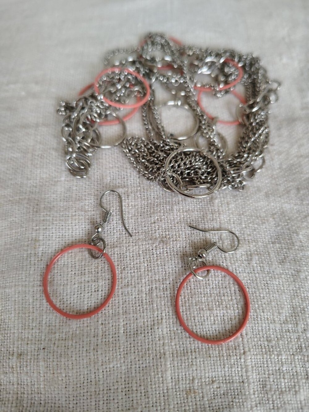 Long multi chain necklace with silver tone & peach circles + earrings